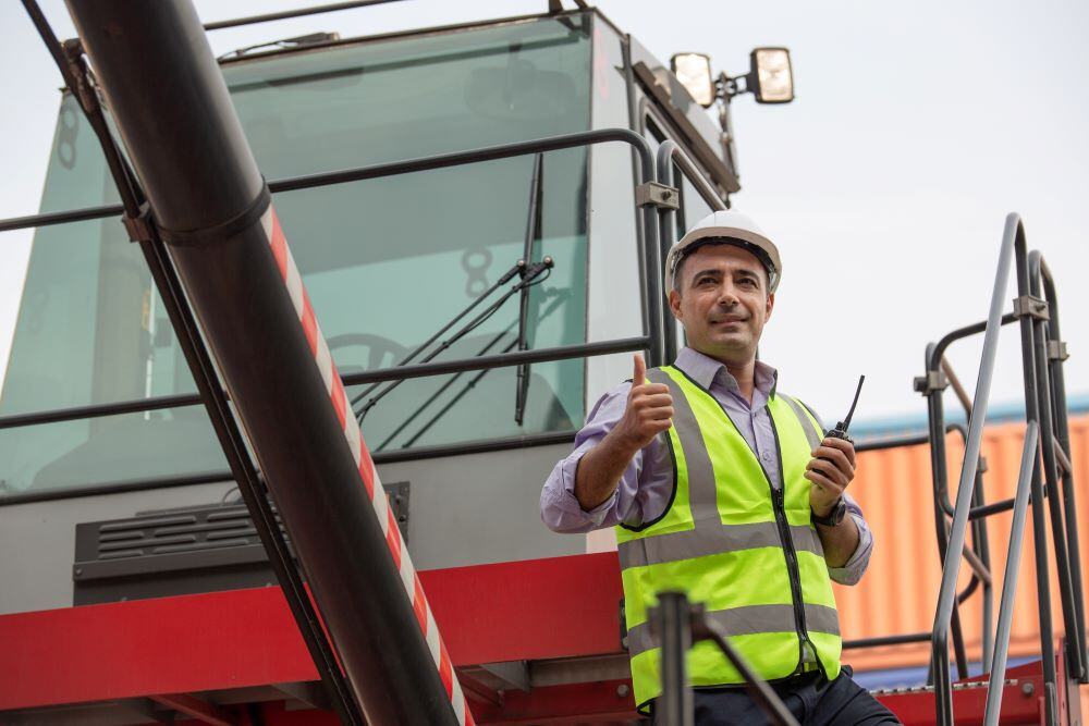 logistic-manager-showing-thumbs-up-standing-on-the-2023-11-27-05-03-31-utc